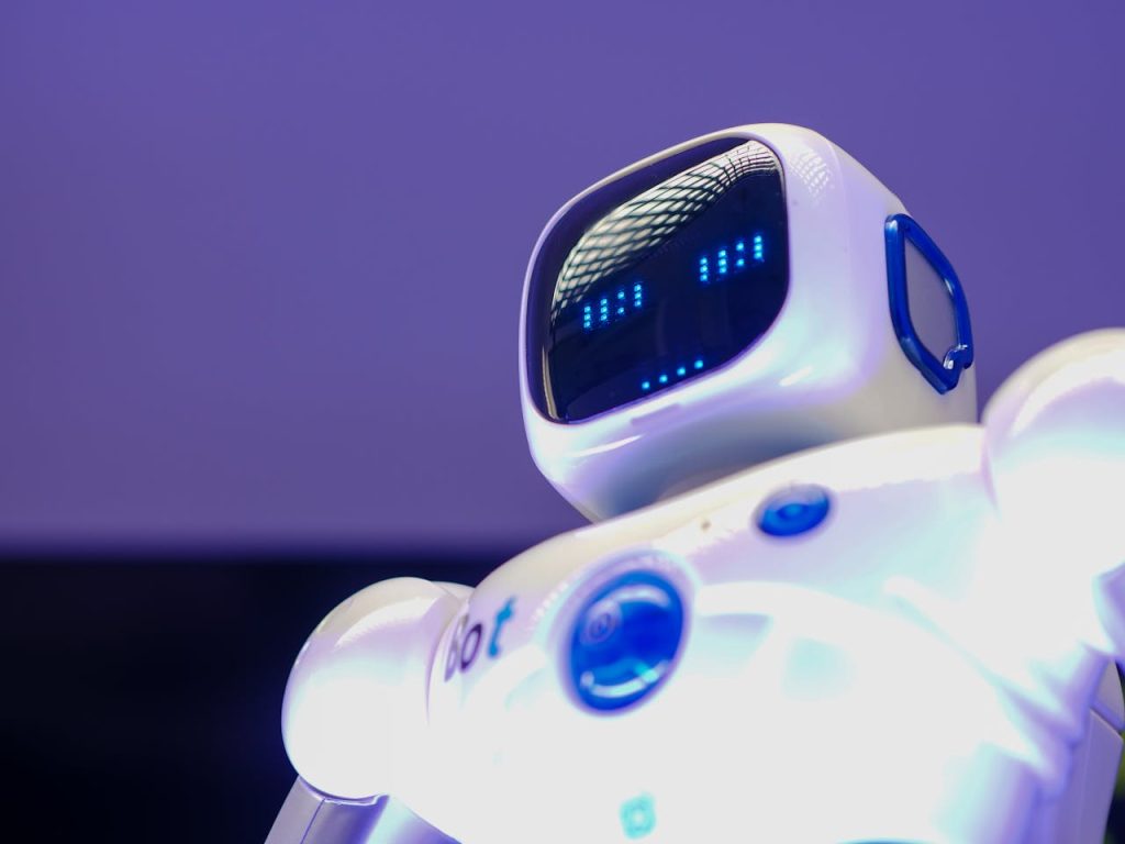 Mastering the First Impression: Your intriguing post title goes here A modern humanoid robot with digital face and luminescent screen, symbolizing innovation in technology.